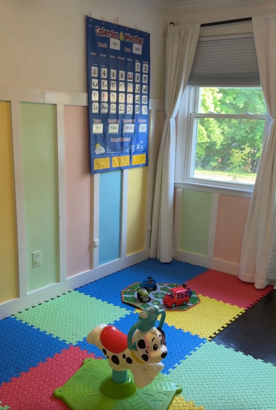 Colorful indoor play and learning room at Care's Corner
